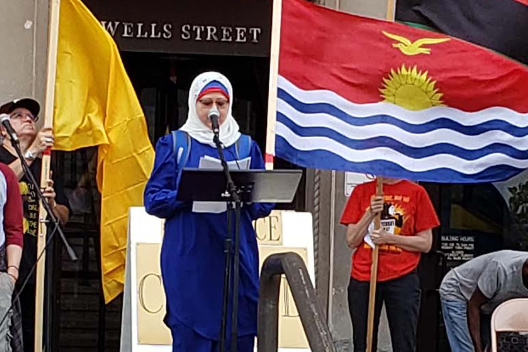 A woman speaks at the climate rally