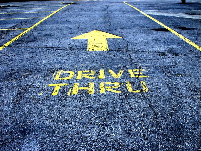 Drive Thru Sign on Pavement. Photo by frankieleon.