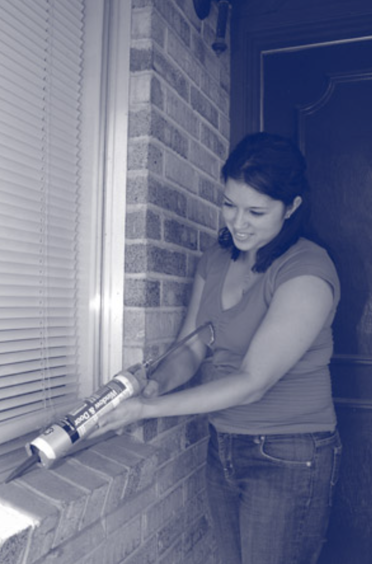 Woman sealing window