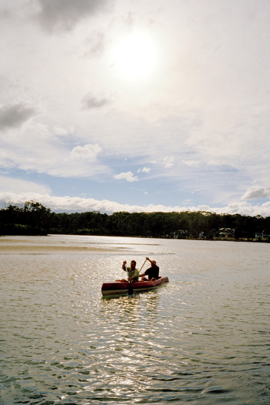 Two people kayaking on river