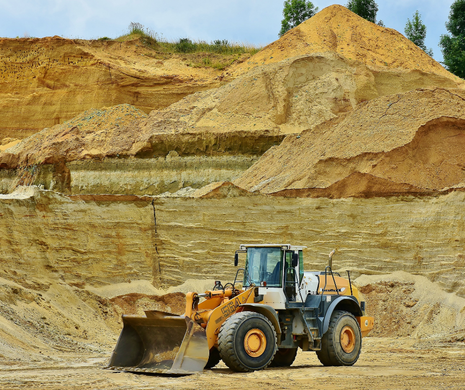 Bulldozer moving sand in an open pit frac sand mine