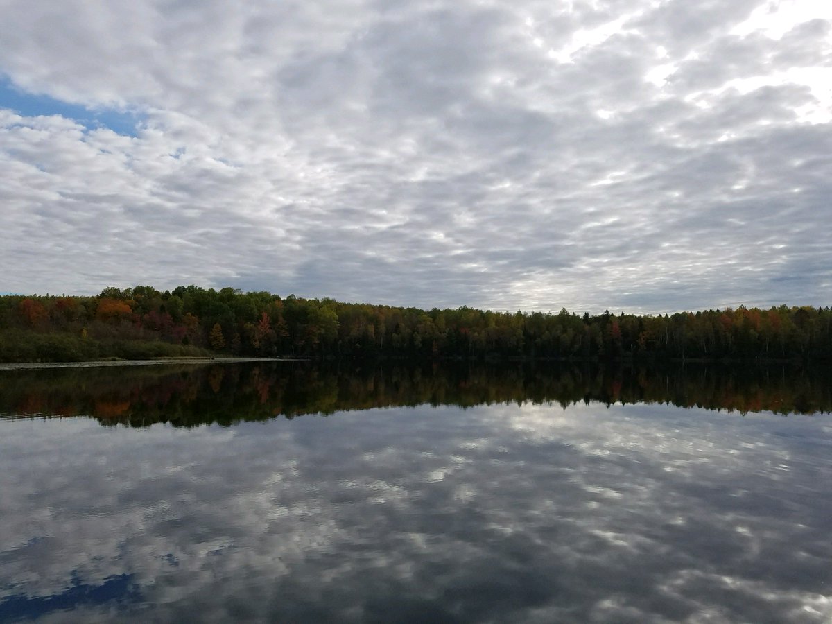 Lake in northern Wisconsin with forests and clouds