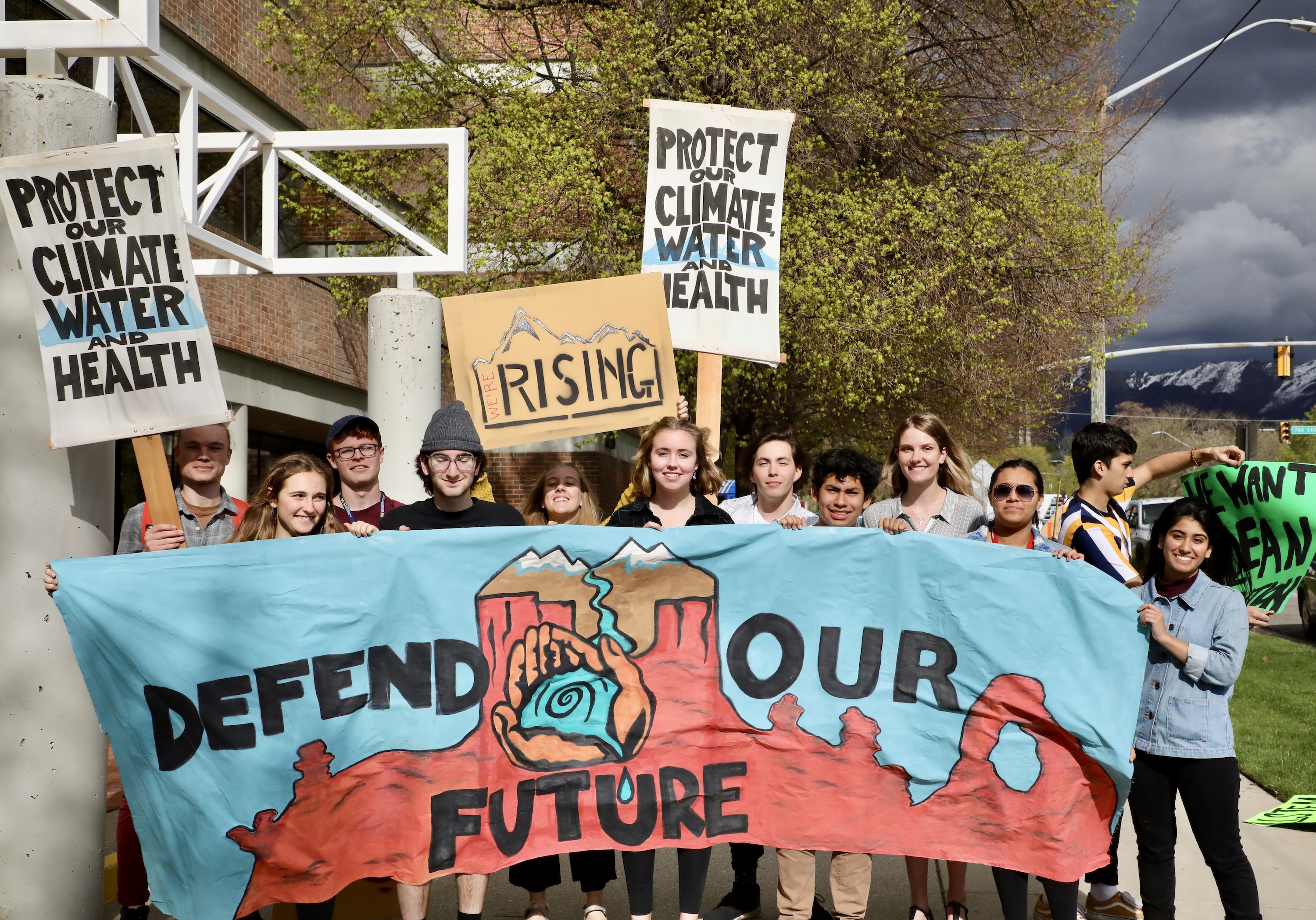 Youth Activists with "Protect Our Future" sign