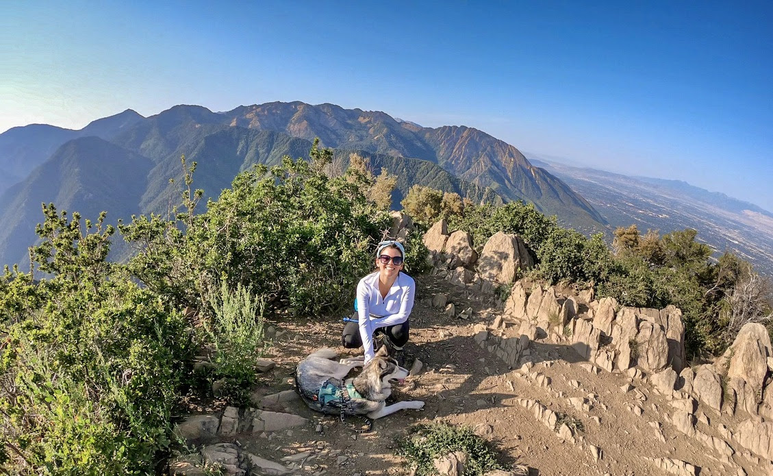   Director, Carly Ferro, at the summit of Grandeur Peak with her pal Ghost