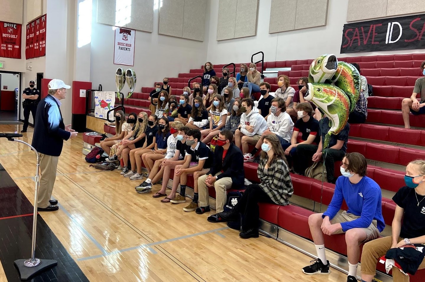 Rep Simpson speaking to a group of high school students in a gymnasium
