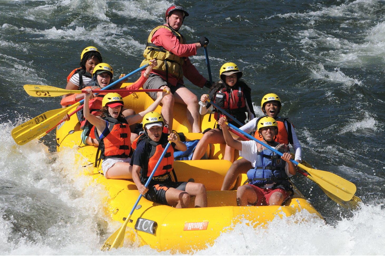 A youth group rafting down a river