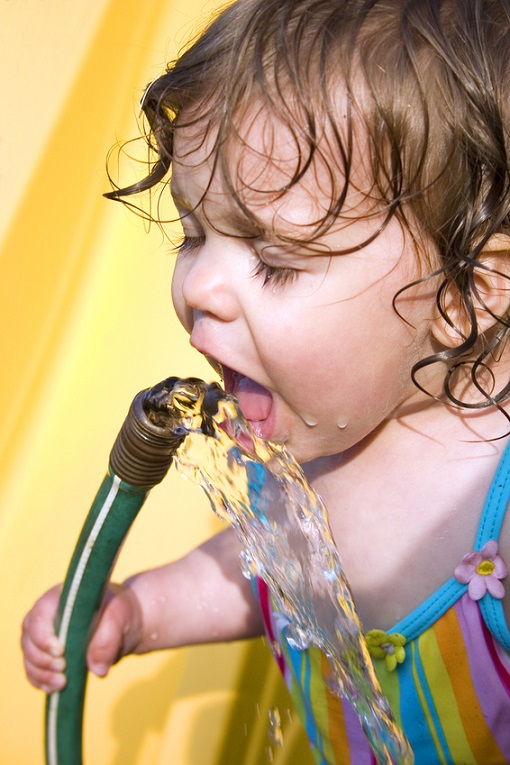Little girl drinking water