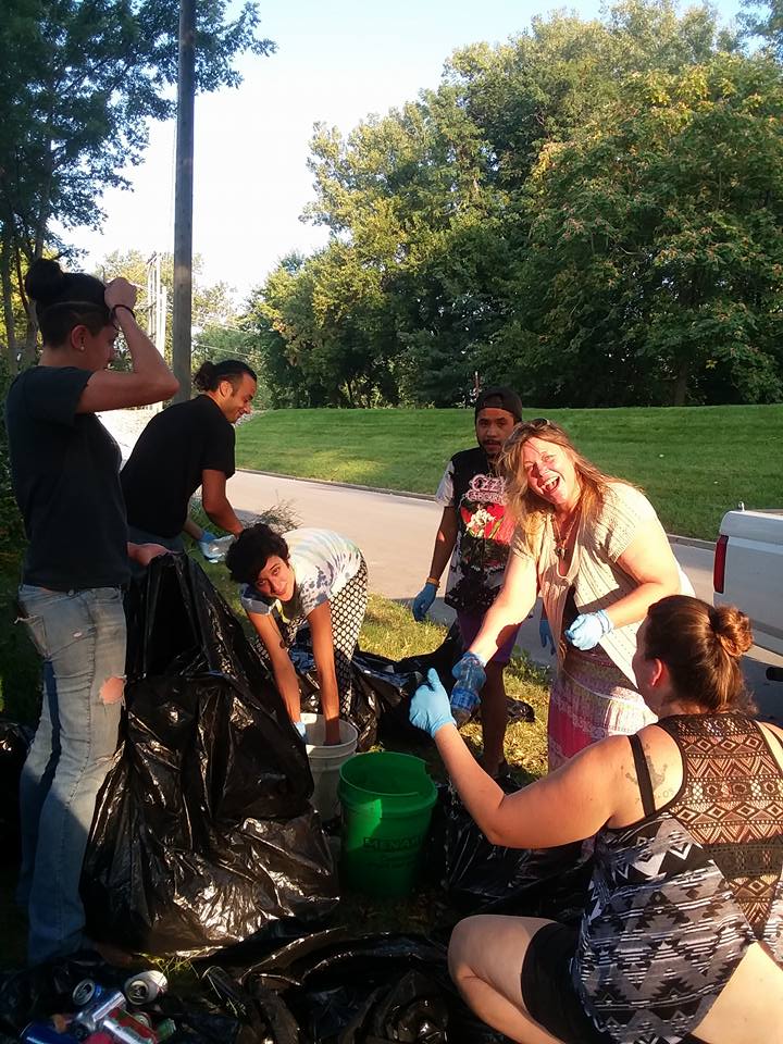 Volunteers sorting recycling trash bags