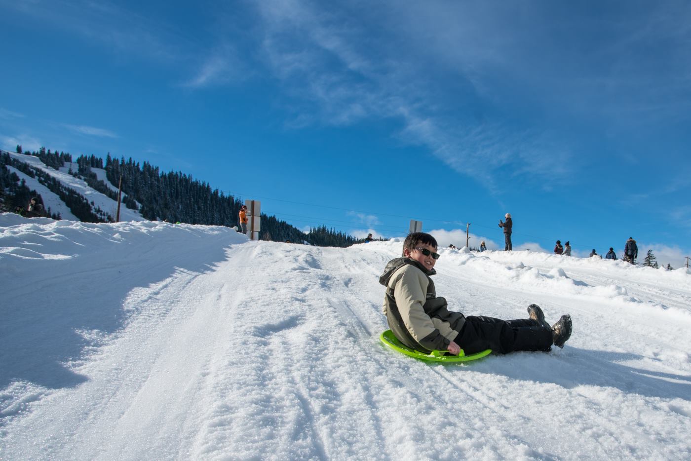 boy sledding at Snoqualmie pass with Seattle ICO