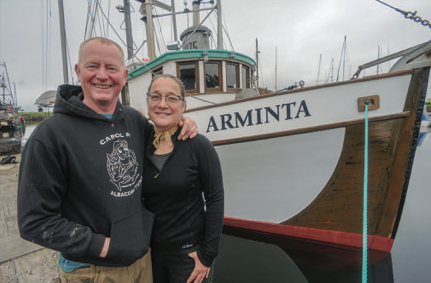 Amy and Greg with their vessel, Arminta (photo: Bill Curtsinger)