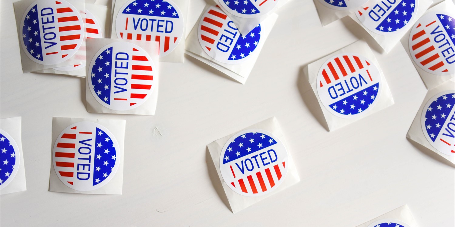 Red, white, and blue I voted stickers against a white background