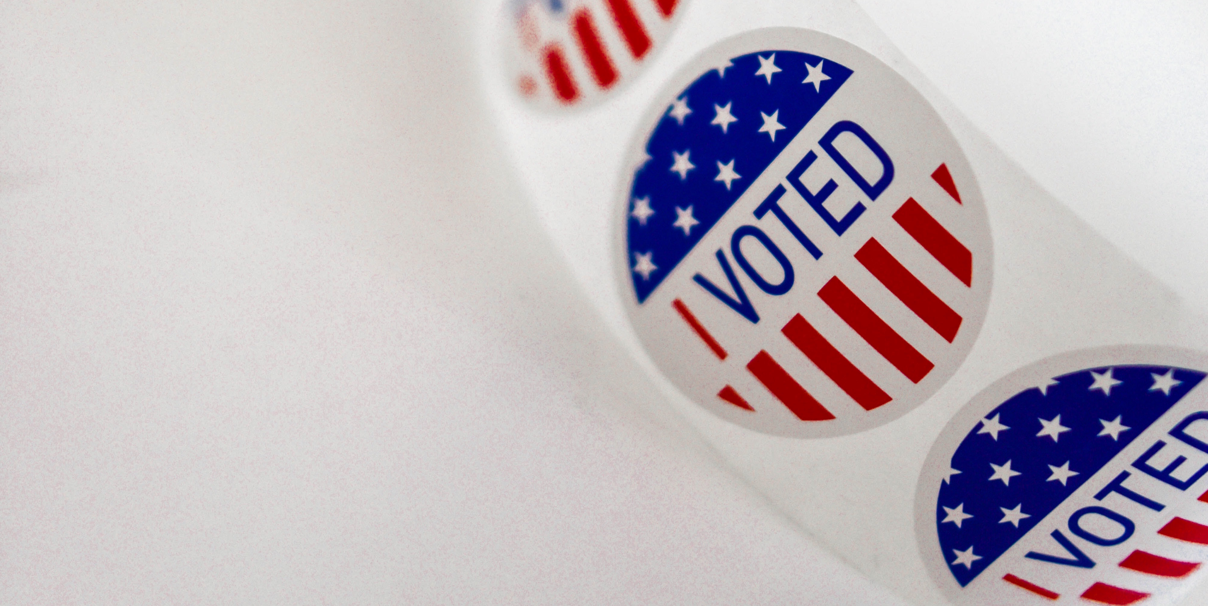 White round sticker with red and blue saying "I Voted!"