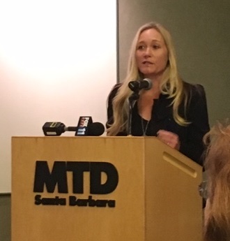 Southern California Edison's Public Affairs Manager Rondi Guthrie speaks in favor of the electric bus goal