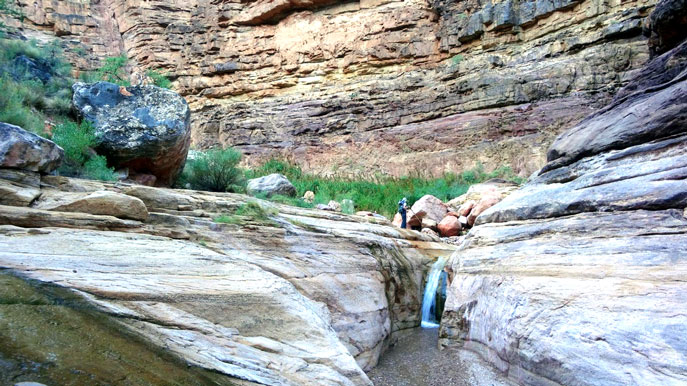 Hiker on the Hermit Trail in the Tapeats sandstone