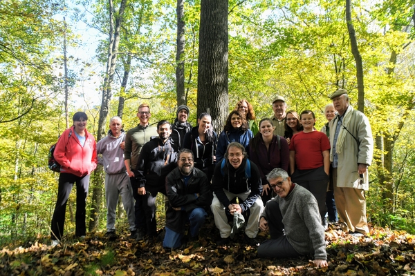 About 15 Sierrans pose for a picture in the woods at Raccoon Creek State Park.