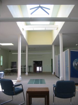 Skylights and multiple windows deliver natural light to the first floor. The glass insert in the floor passes light into the basement.