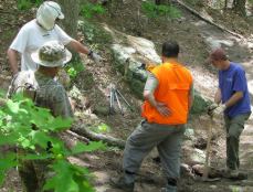 Taking a moment to think about it during trail building.