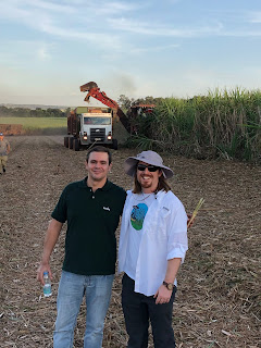 Patrick with Fernando Vanzela of Native Brand with green harvesting in background 