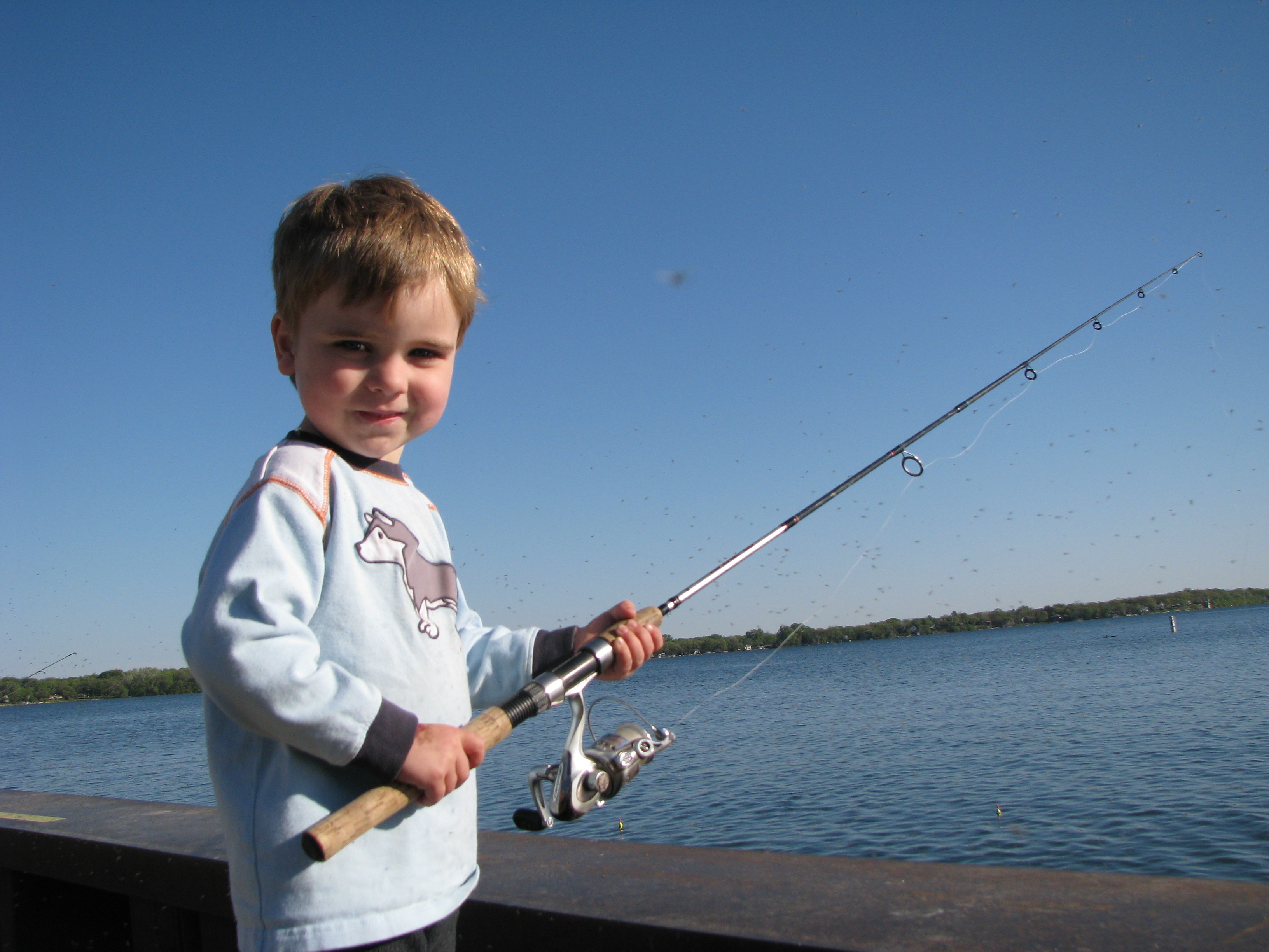 Boy fishing on a lake
