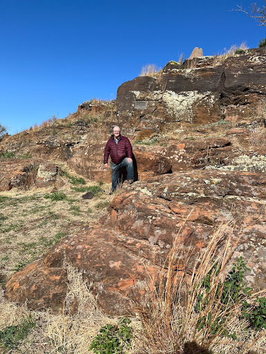 man on large rocky hill