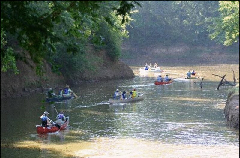 Canoes heading down river