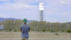 Man observing concentrated solar installation