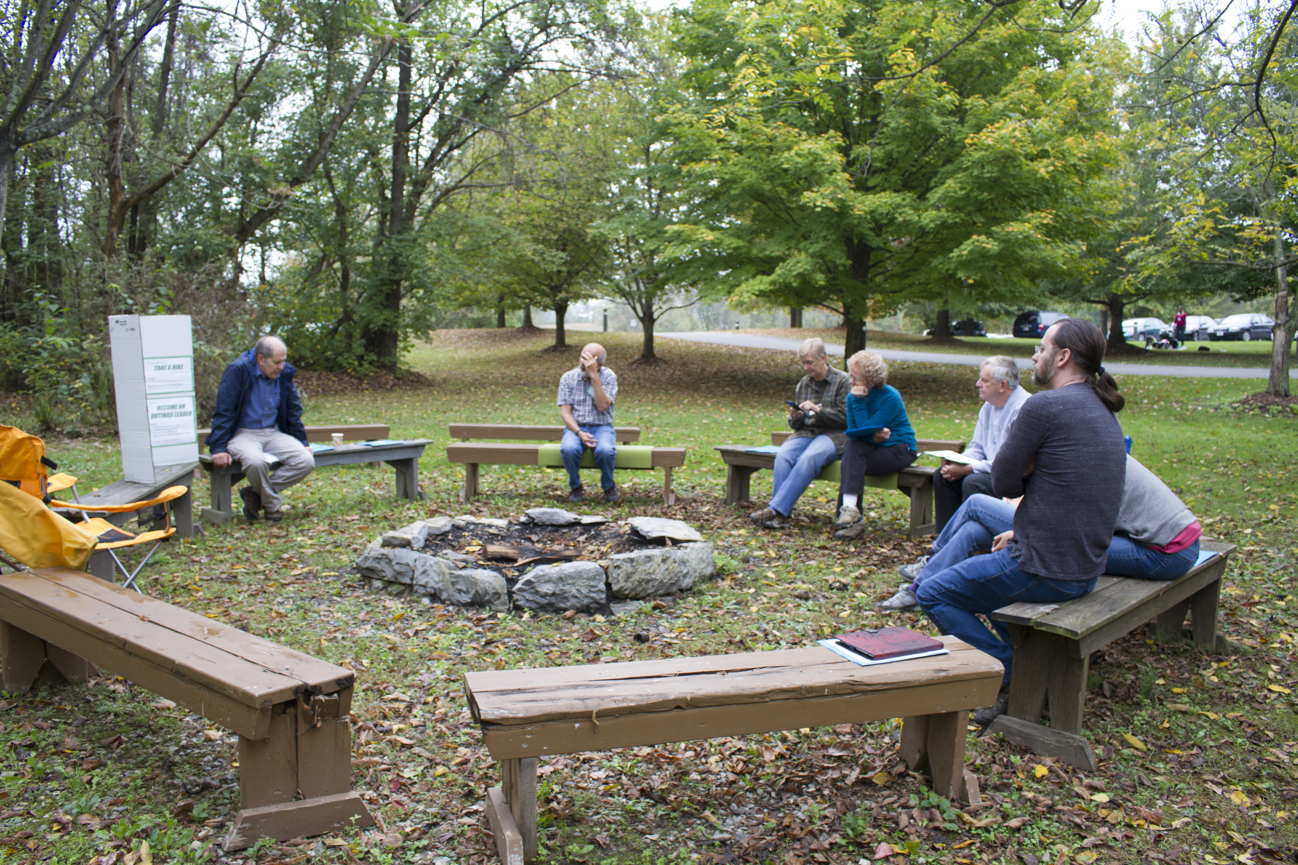 people sitting in circle for outdoor workshop