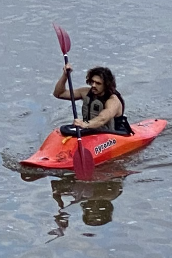 young man kayaking