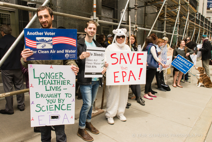 Rally members holding signs: Another voter for Clean Air and Water