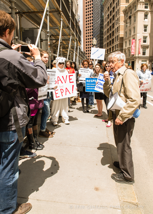 A pjotographer taking a picture of the rally outside the EPA office