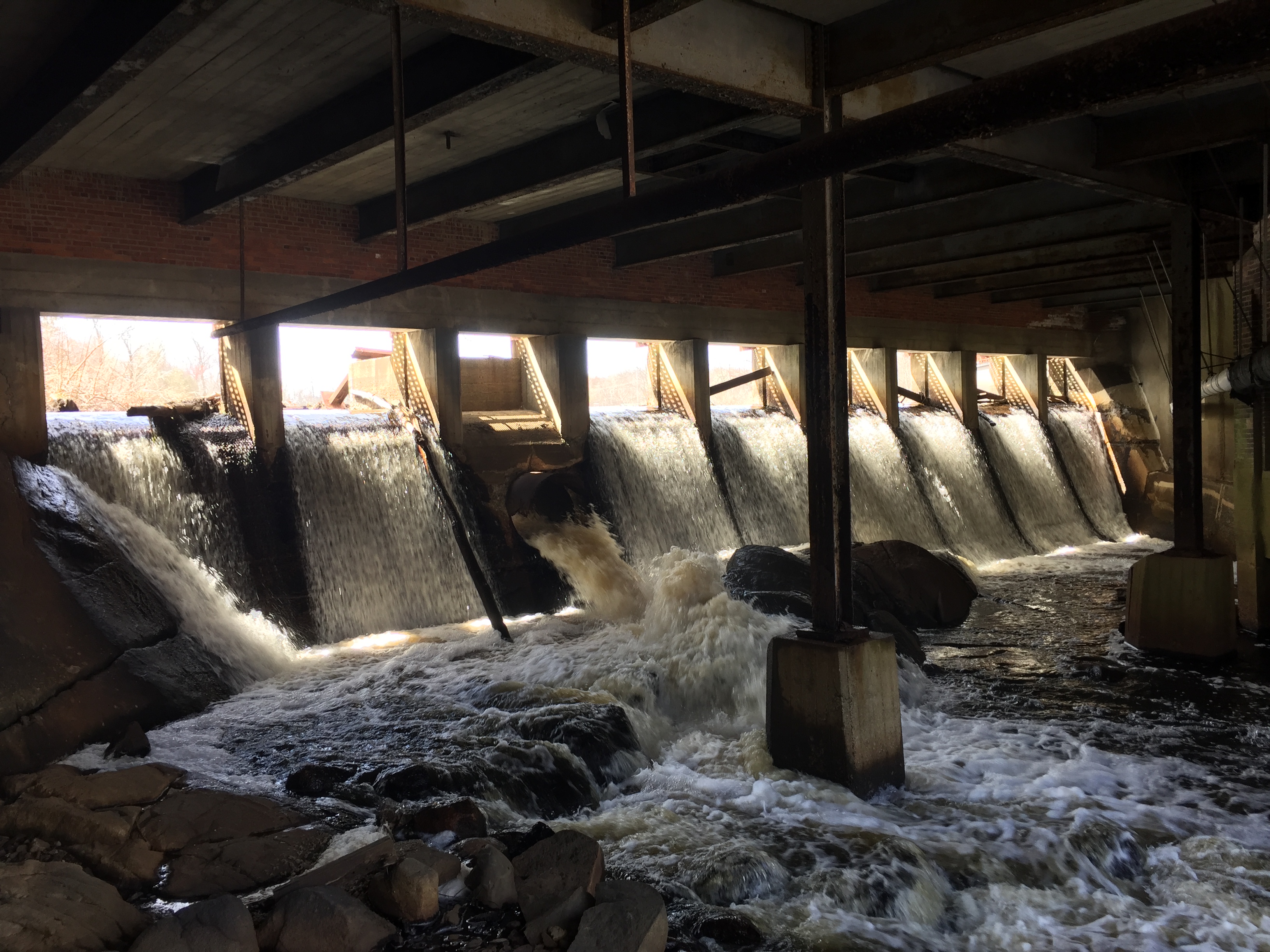 Water flowing over a dam