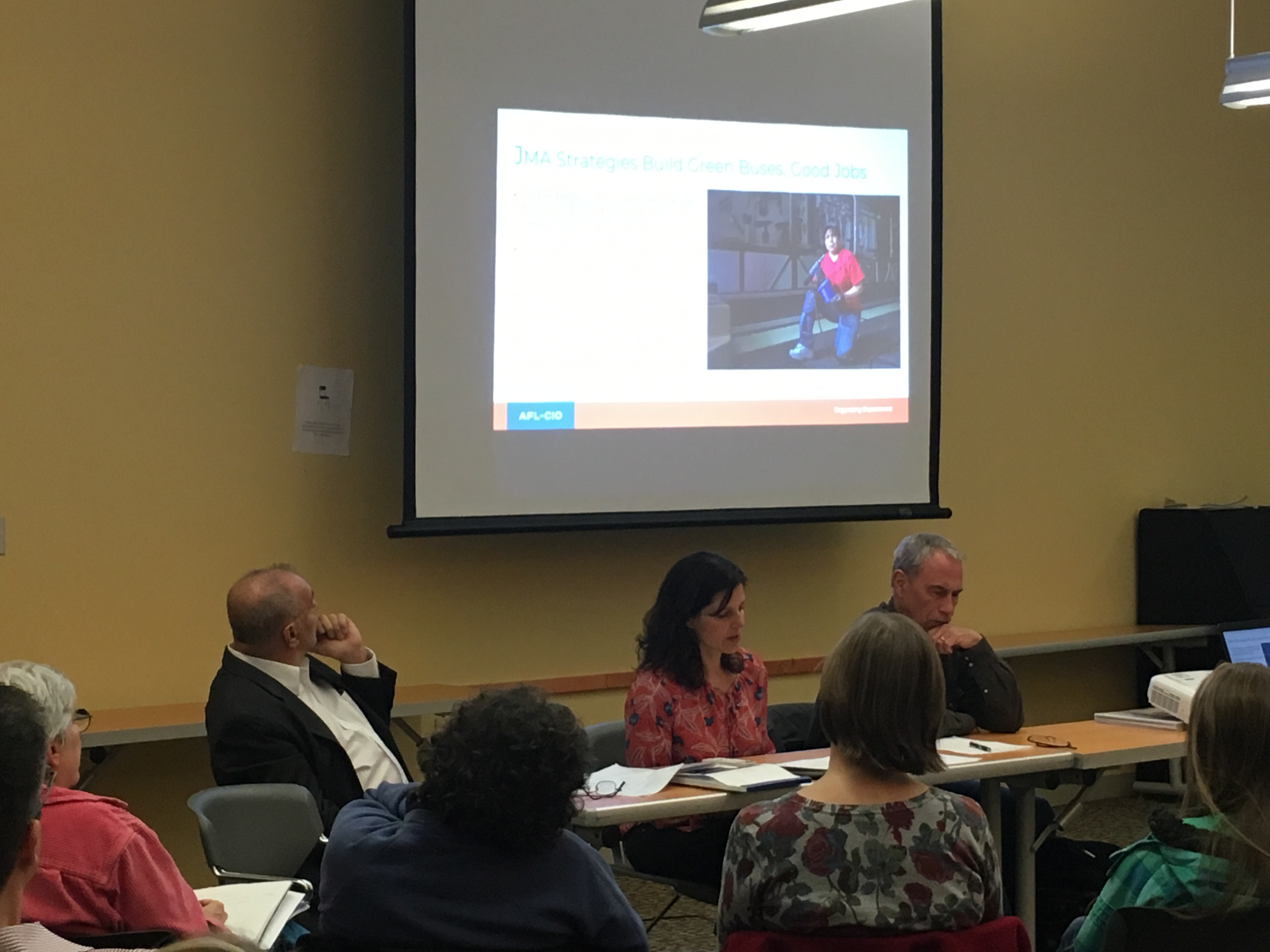 Group attending panel discussion on labor and the environment. Photo 4 of 5