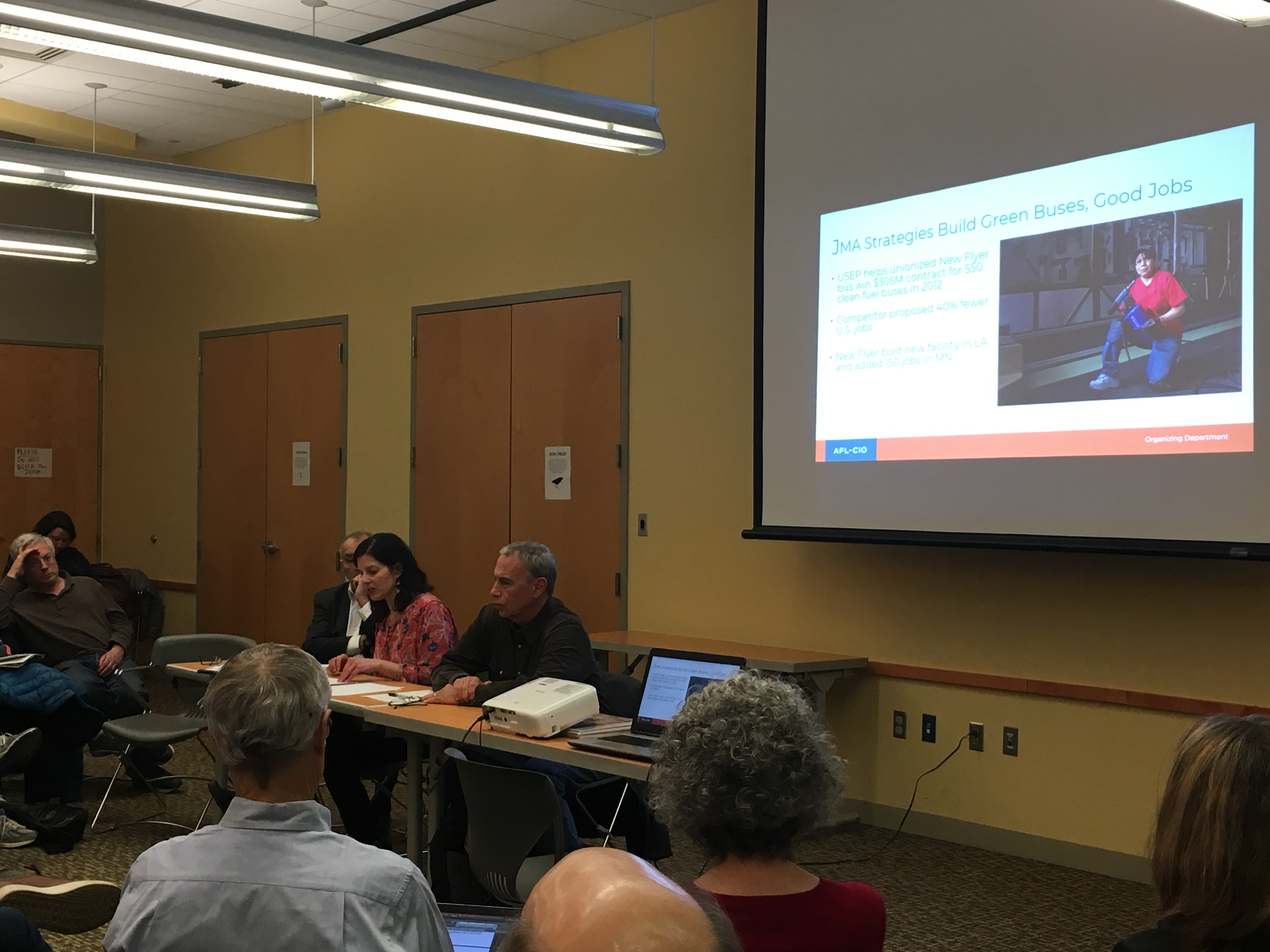 Group attending panel discussion on labor and the environment. Photo 5 of 5