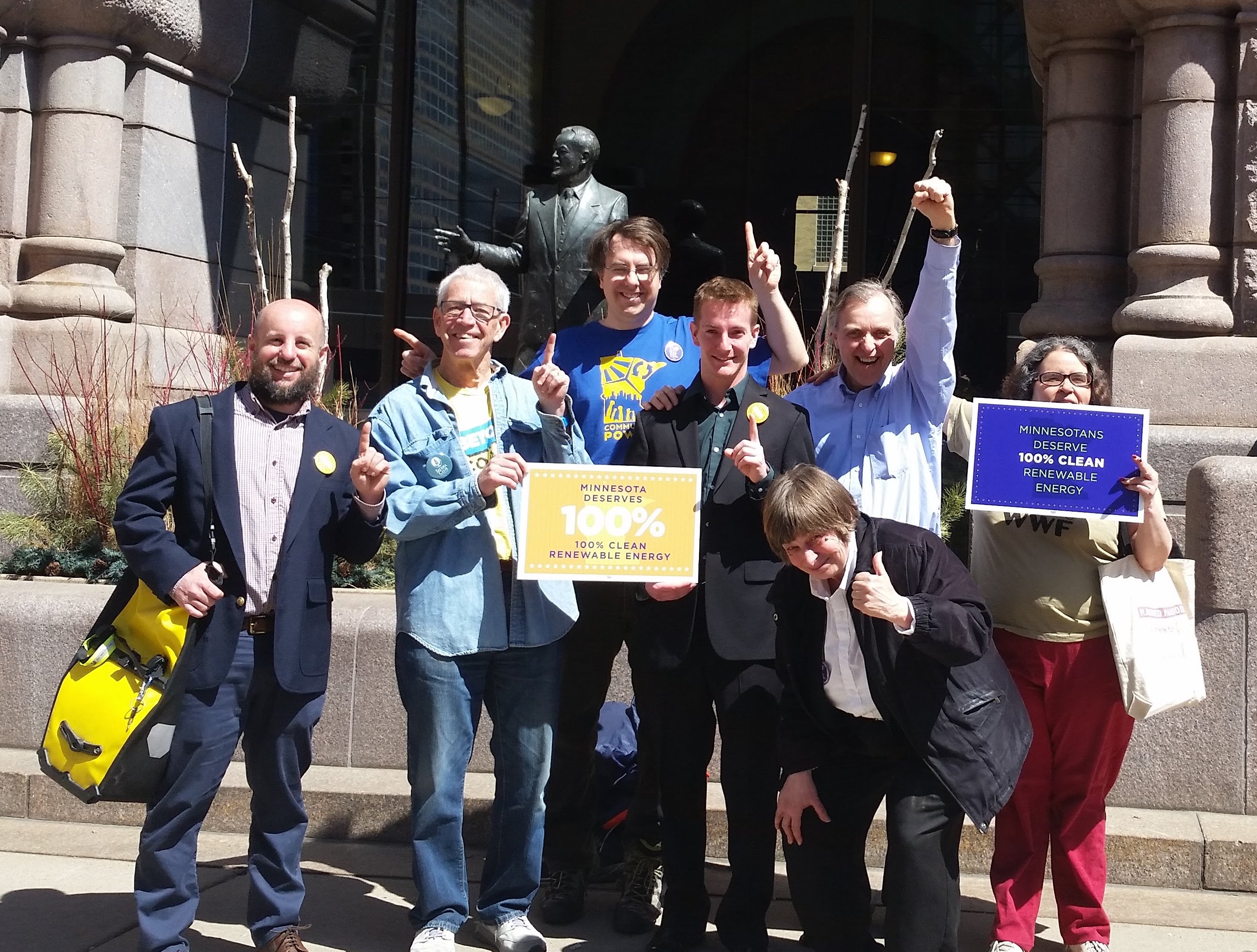 Sierra Club volunteers celebrate outside with resolution author Council Member Gordon