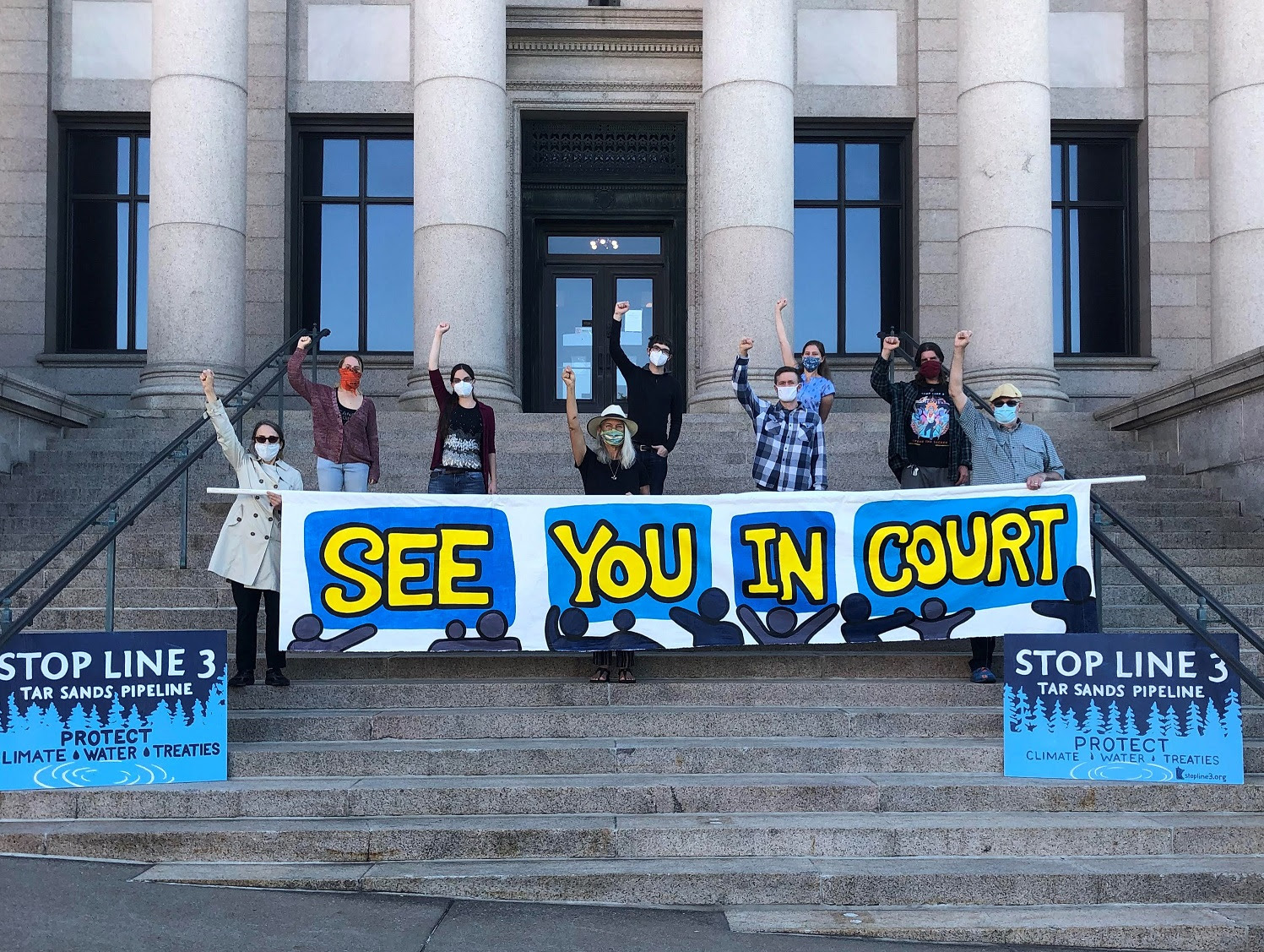 Photo of Stop Line 3 protesters on courthouse steps