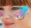 photo of woman wearing glitter makeup. Getty Images