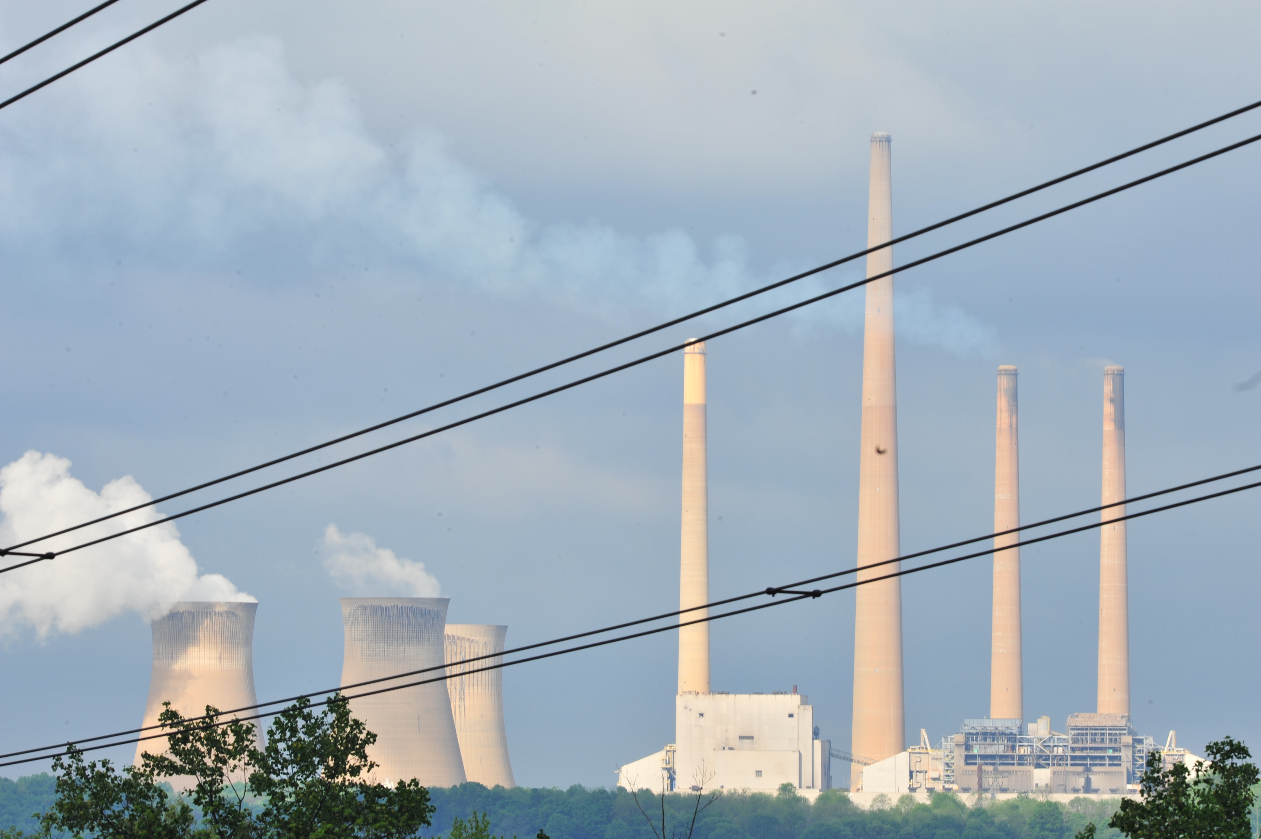 Power line stretch against a coal-fired power plant.