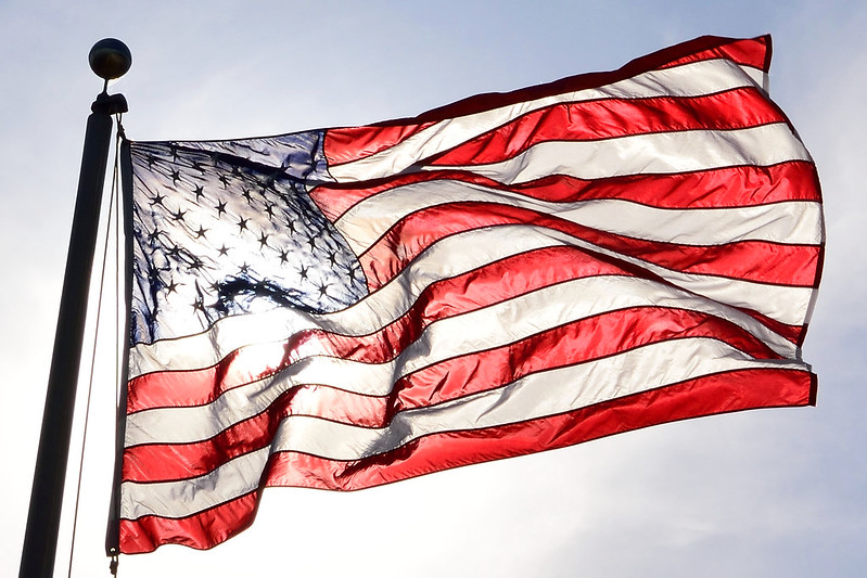 Photo of American flag blowing in wind