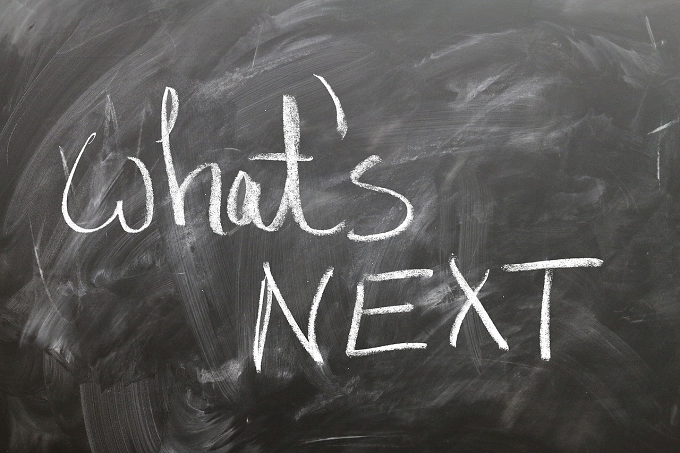 Black chalkboard with "What's Next?" written in chalk