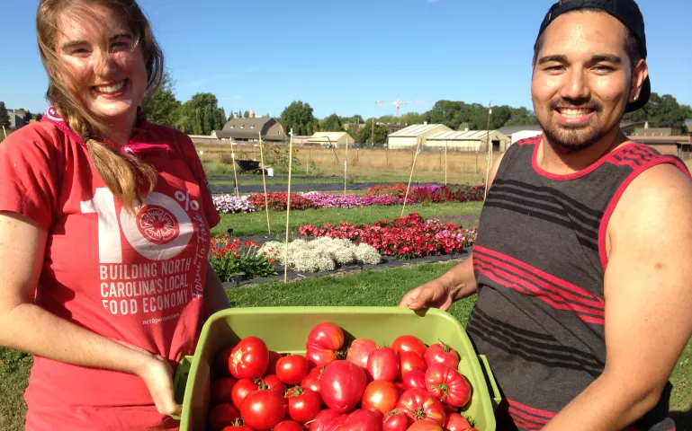 Oregon State University students Annie and Nazario, at work in one of OSU's many student- and volunteer-managed gardens. 