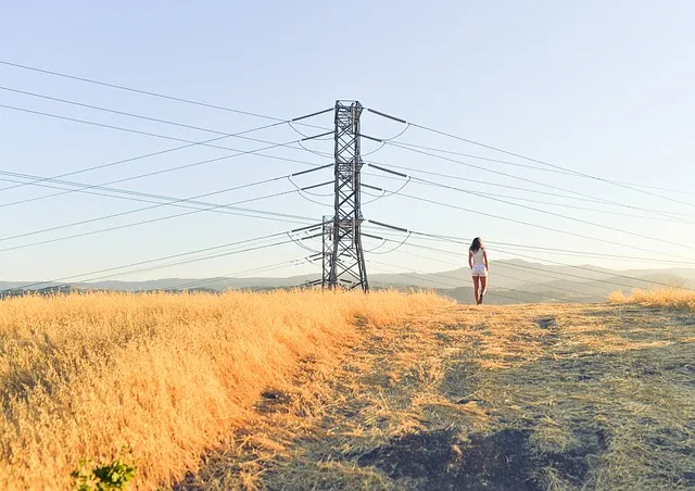 woman standing next to electric cables