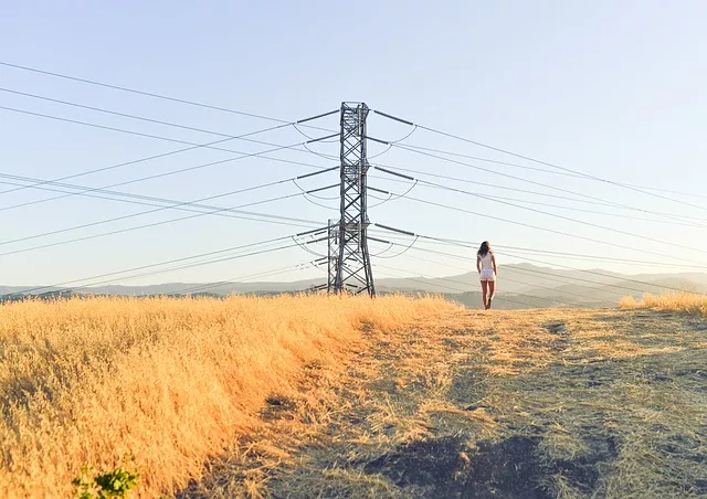 woman standing next to electric cables