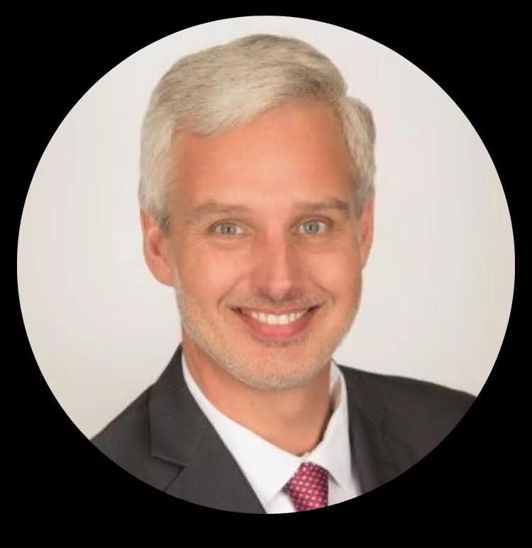John Chatowski headshot in circular frame