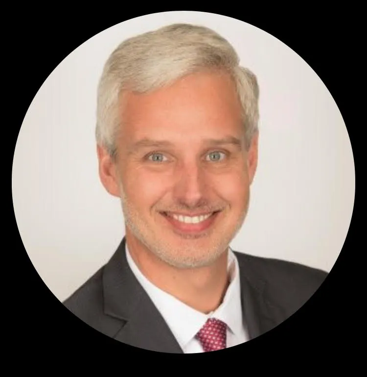 John Chatowski headshot in circular frame