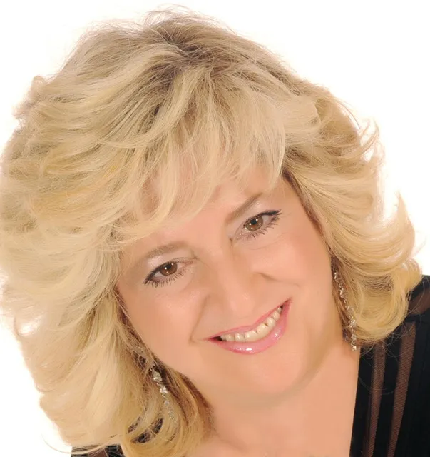 Holly Thier smiles on a white background