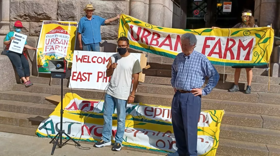 Community organizer Joe Vital and Dean Dovolis at a City Hall event advocating the Urban Farm.