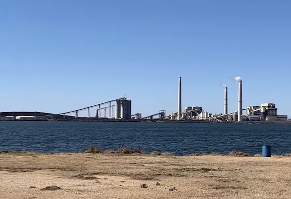 The Spruce coal plant sits behind Calaveras Lake in San Antonio.