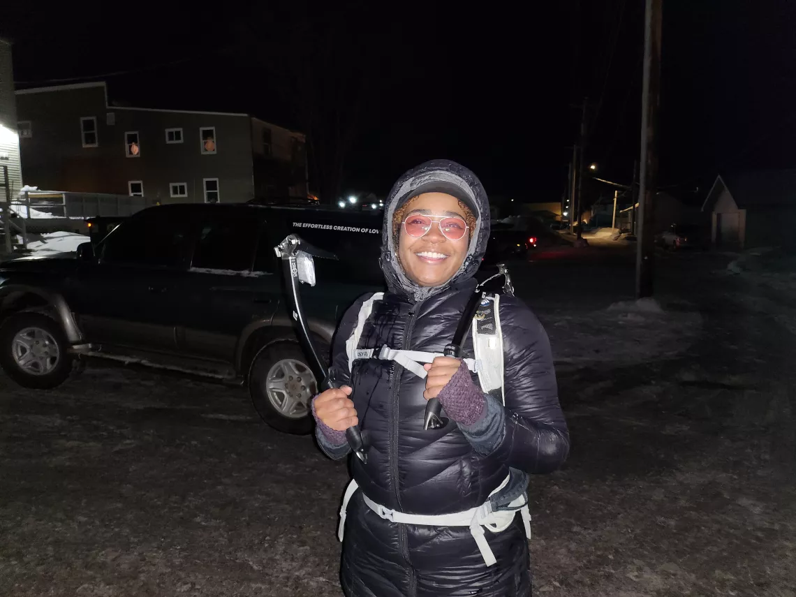 Meg Matthis holds her raffle prize of two Black Diamond ice tools.
