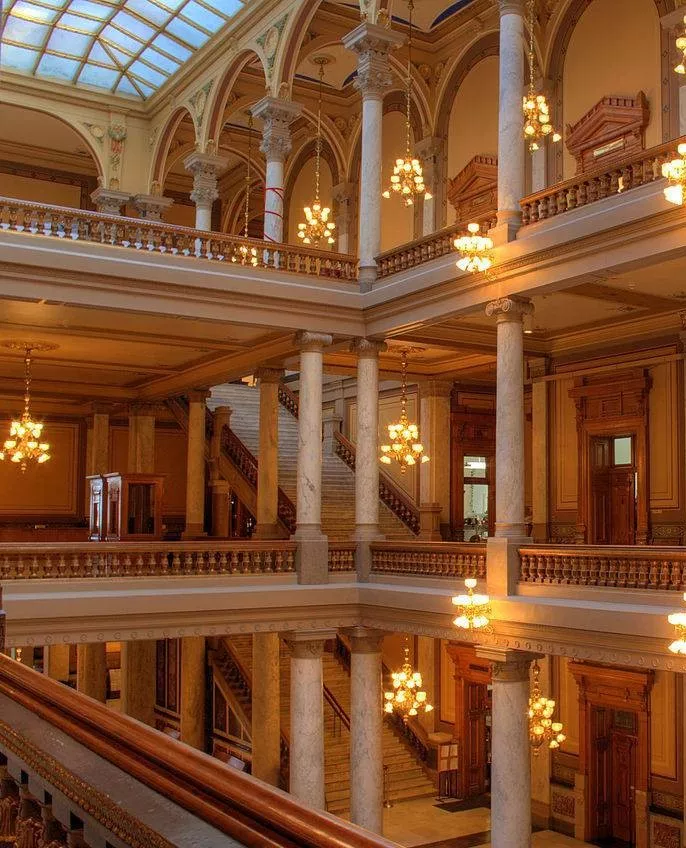 An interior shot of the Indiana statehouse halls, showing tall columns