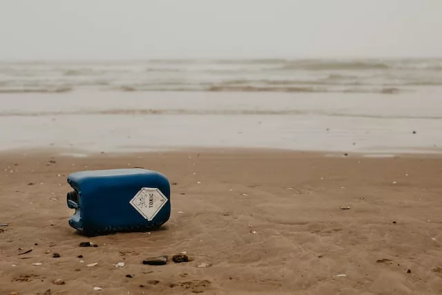 Trash labeled "toxic" on a shoreline.